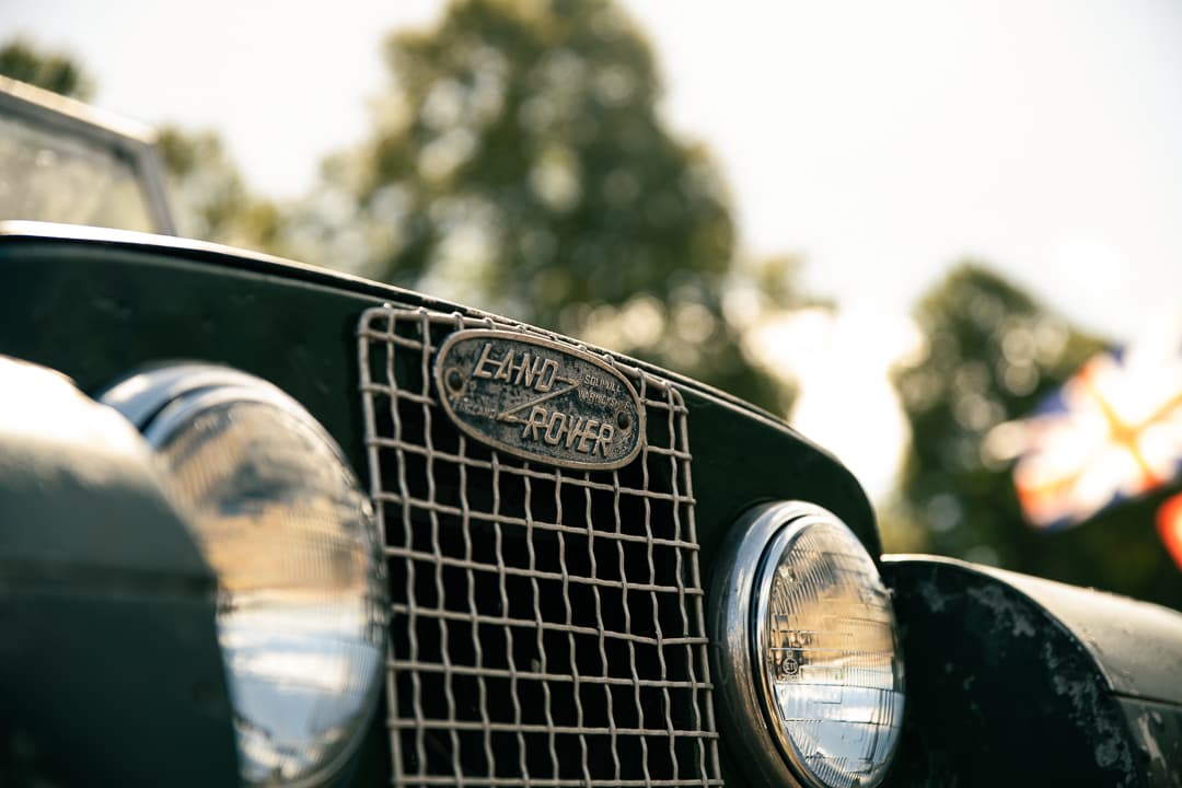 Land Rover badge on the grille of a vintage Series Land Rover