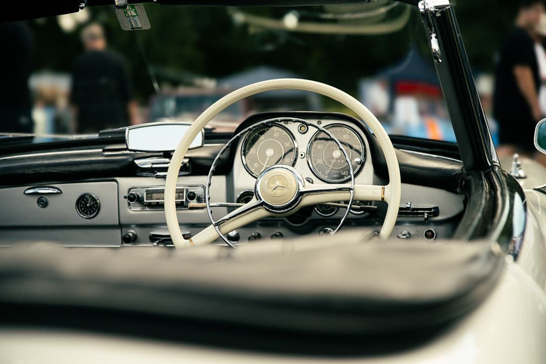 Ivory steering wheel and dashboard of a classic Mercedes roadster