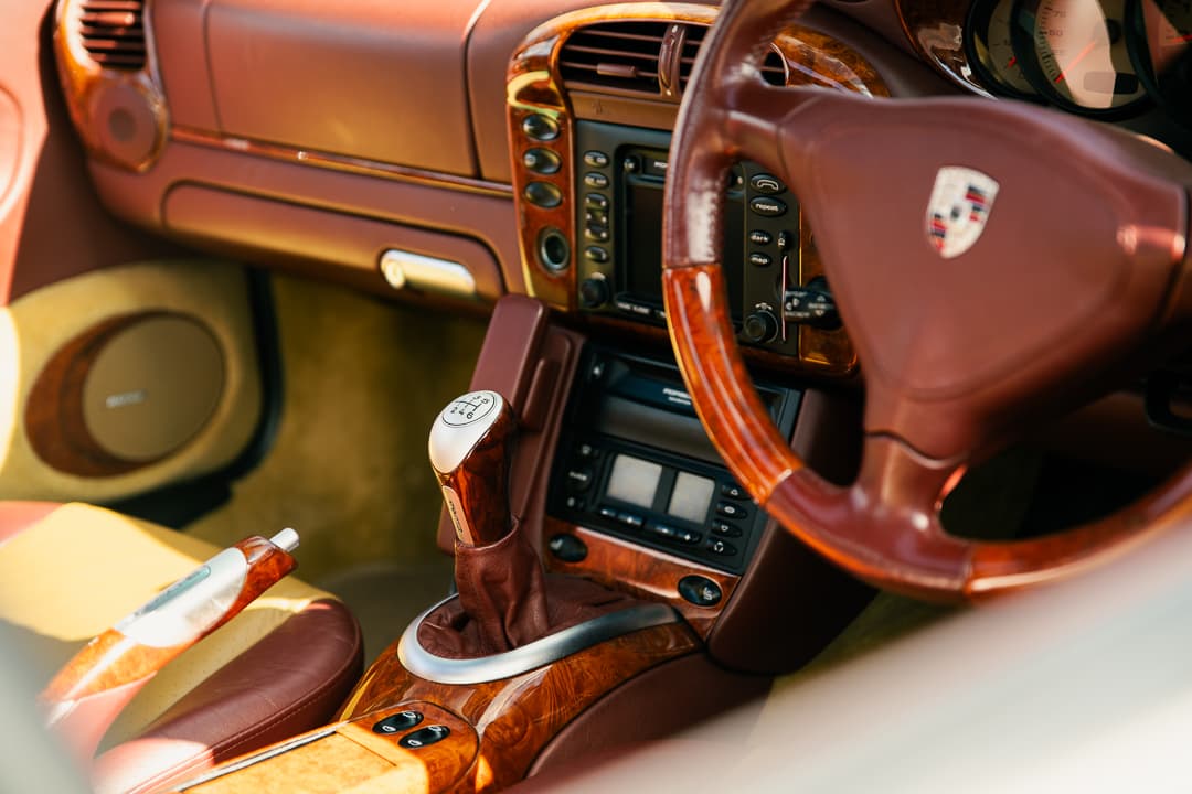 Wood trim and terracotta leather interior of a Porsche 911