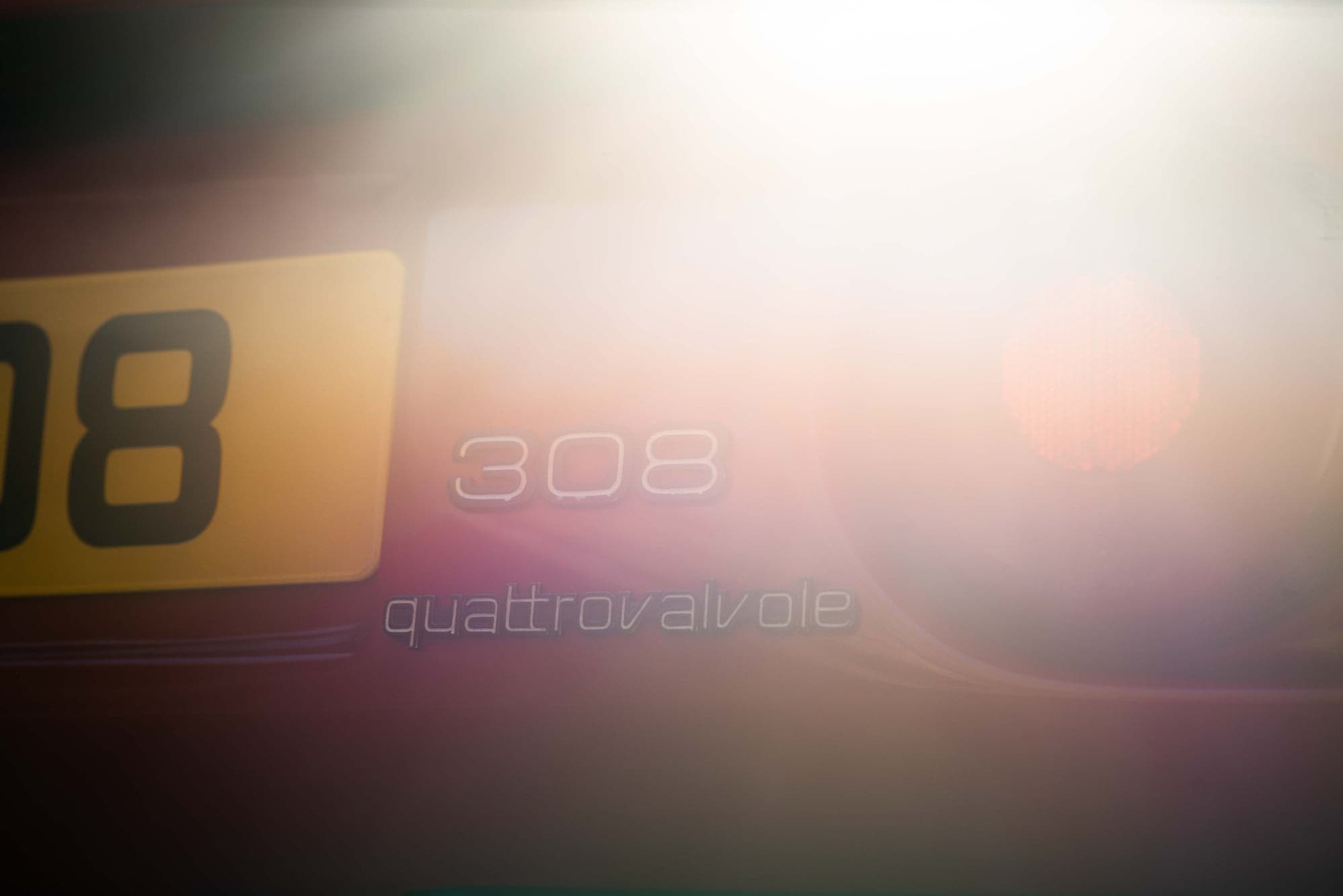 308 quattrovalvole lettering and yellow number plate glowing in backlight