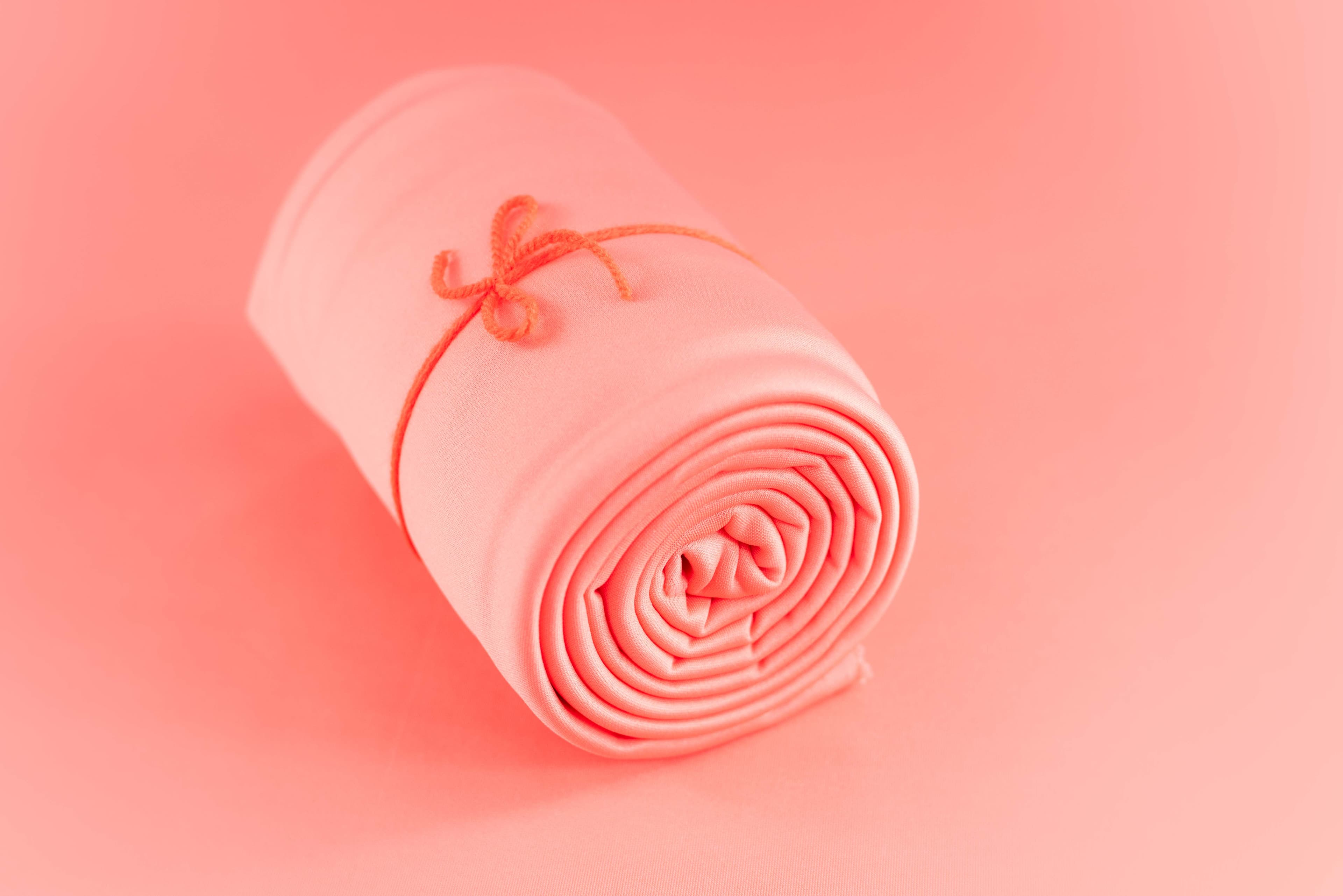 Artistic folds in peach fabric