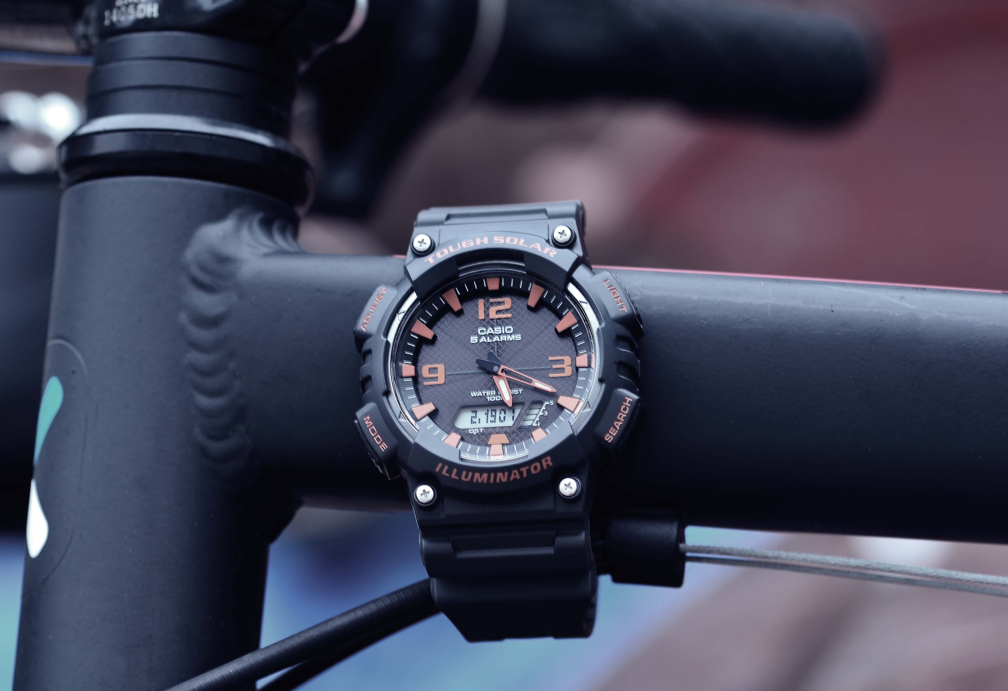 Casio all-weather watch strapped to a bike