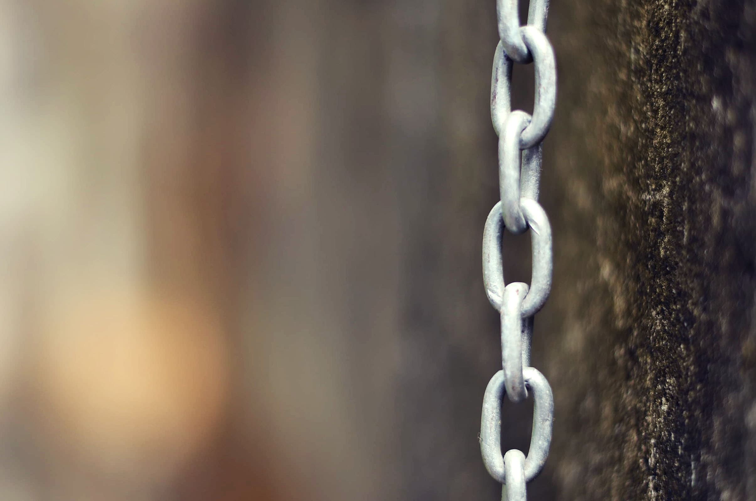 Hanging chain against textured molded wall