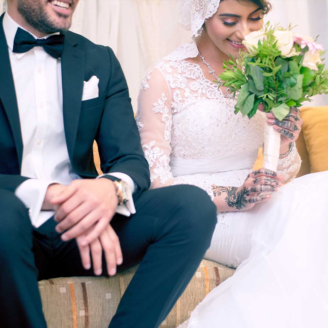 Shy bride smiles as groom speaks of their future together