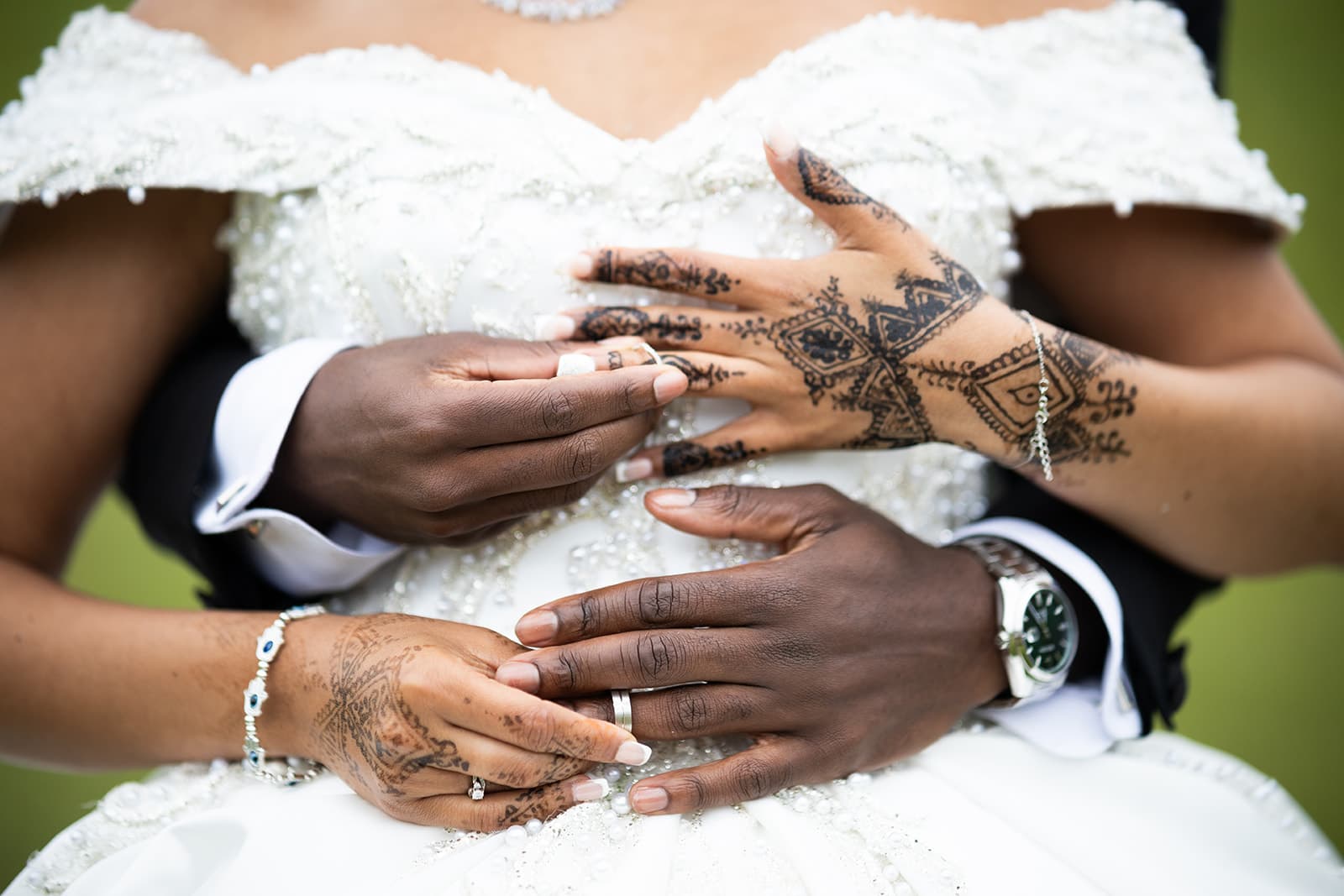 The bride and groom show off their wedding rings